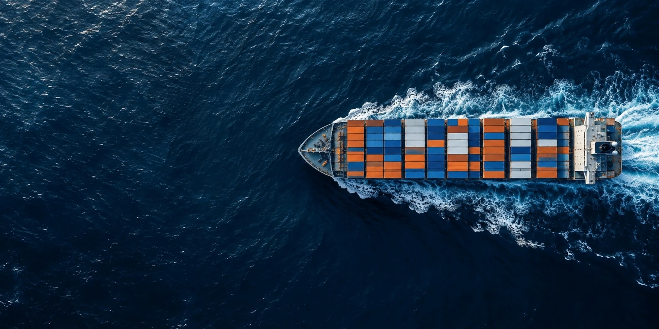Container ship crossing the ocean, seen from above